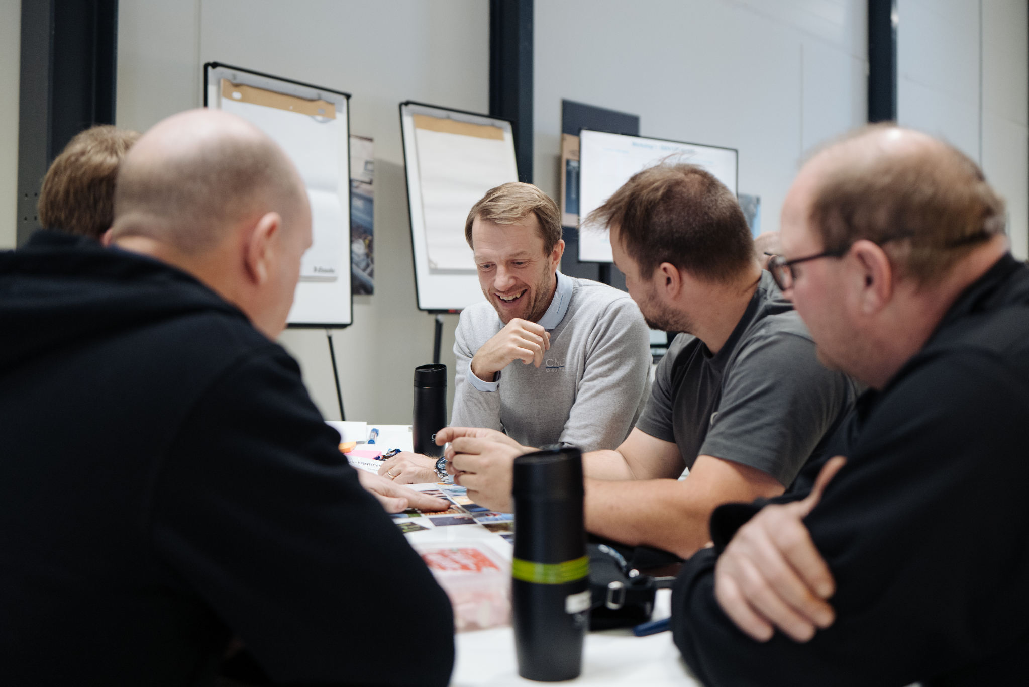 CNC Onsite team discussing future projects and development.