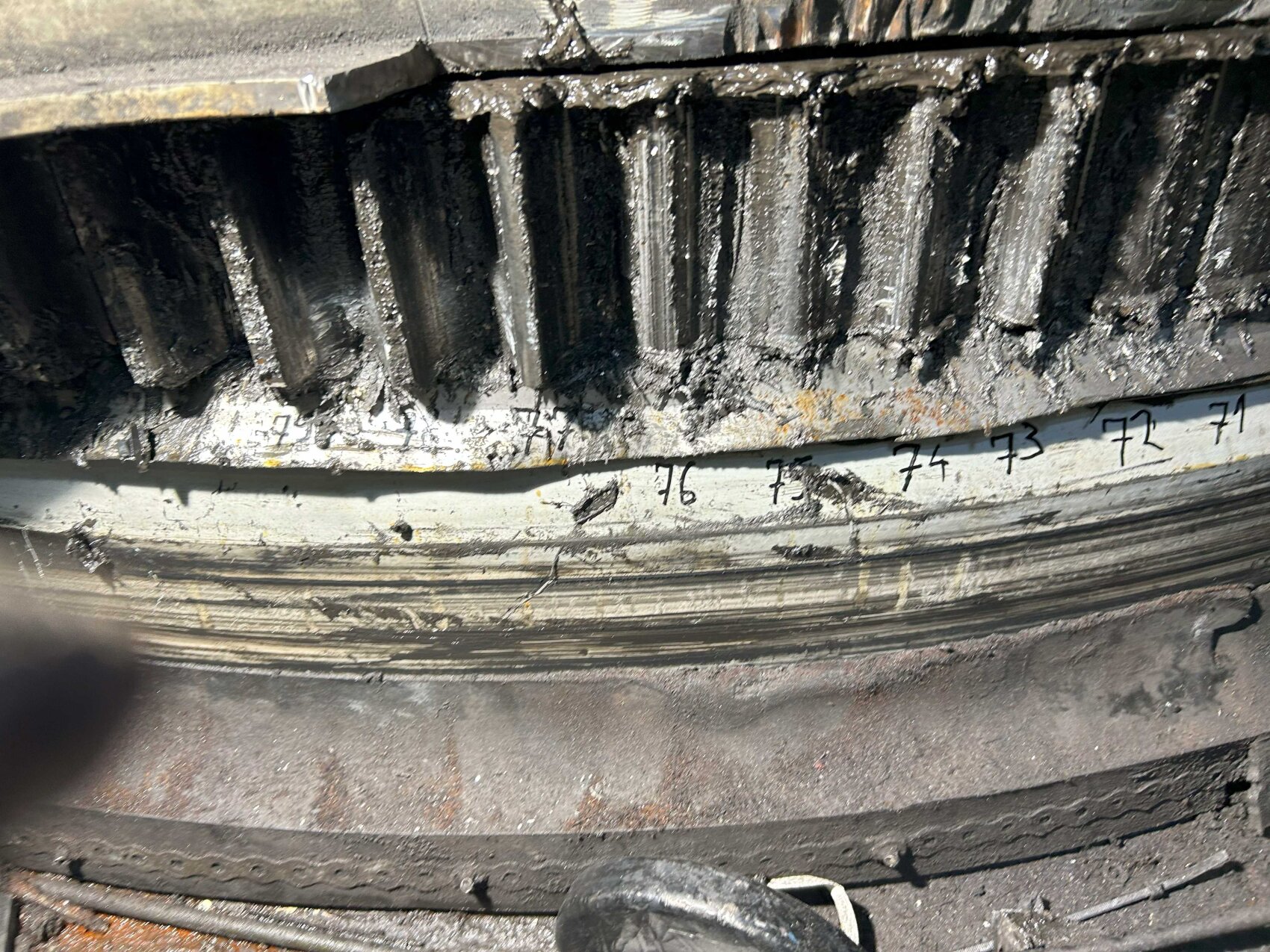 A segment of damaged and worn yaw ring teeth small
