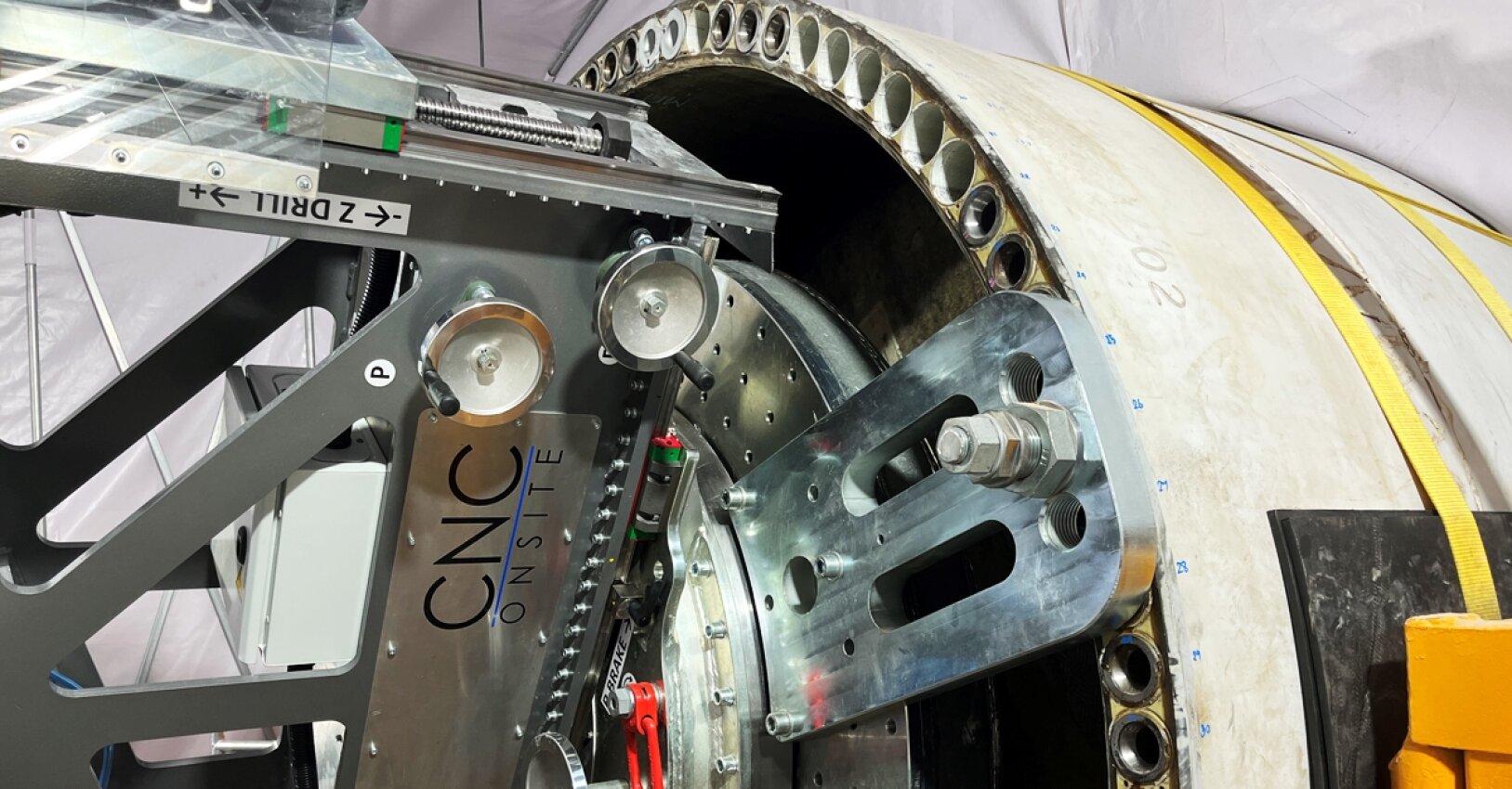The CNC Onsite machine is in the process drilling out loose bushings small