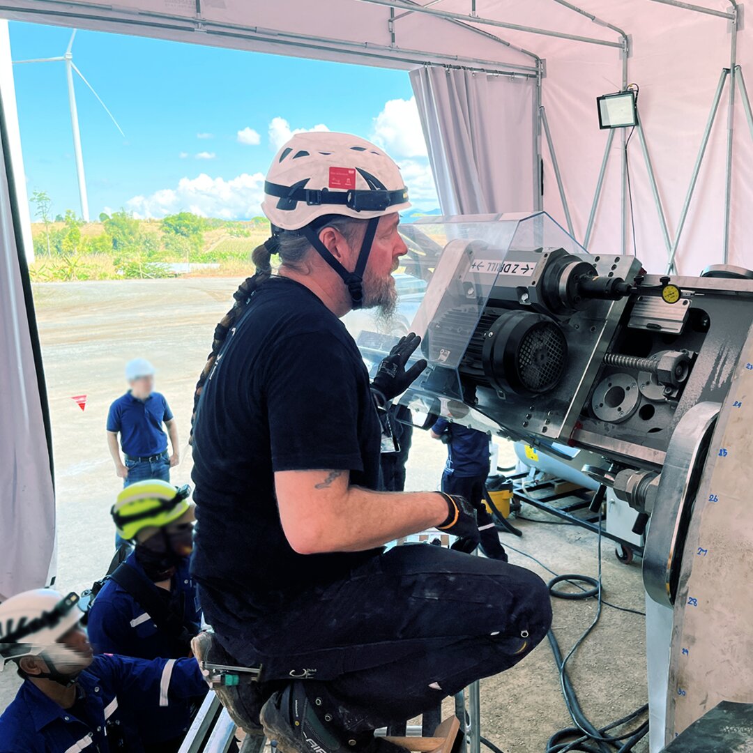The technician monitors the drilling out of loose bushing