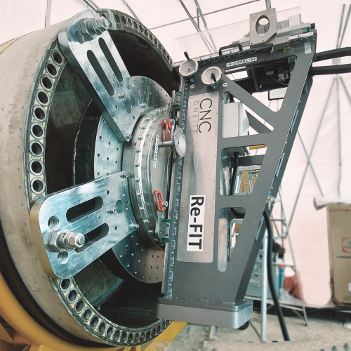 CNC Onsite's mobile precision machine is mounted onto the blade root ready to drill out loose bushings